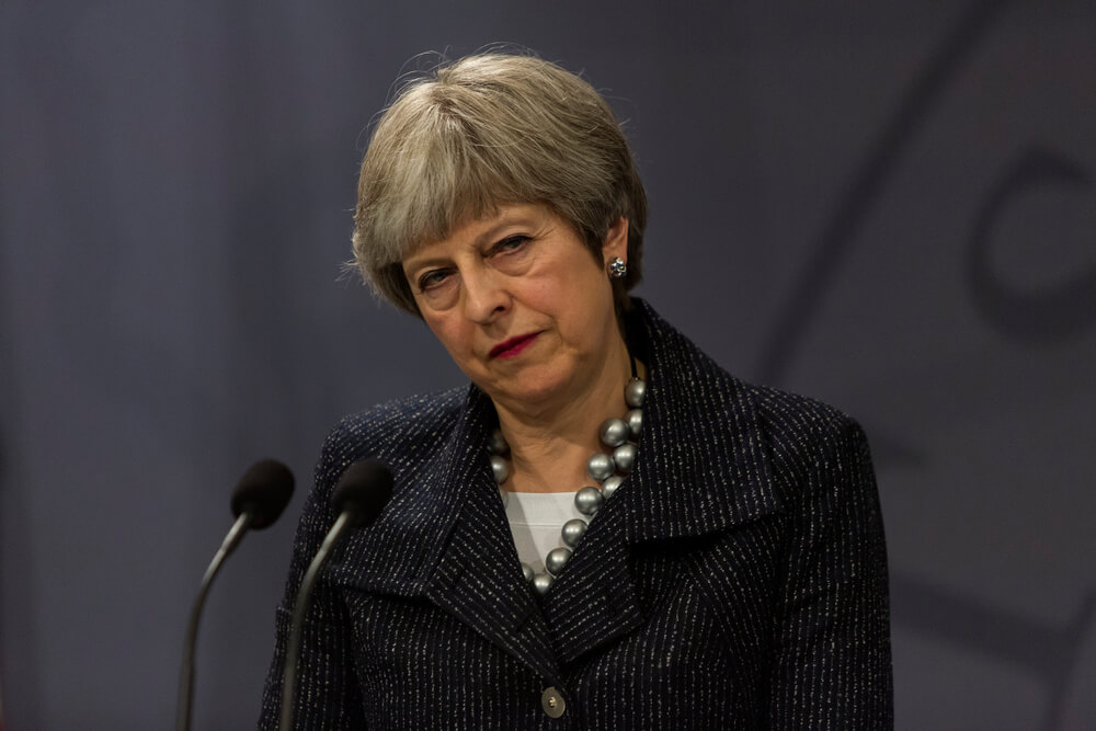 Theresa May Tries to Bury Catastrophic News, Gets Caught Red-Handed