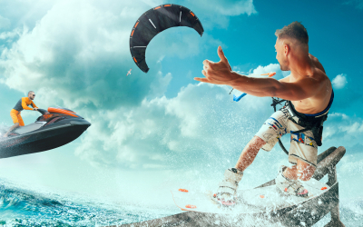 Kite surfing and water scooter in tropical ocean