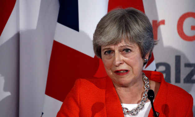 UK’s May, Facing Defeat, Postpones Brexit Vote