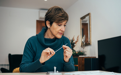 person takes home covid test